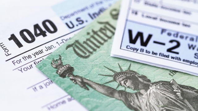 IRS tax forms with tax refund check 
